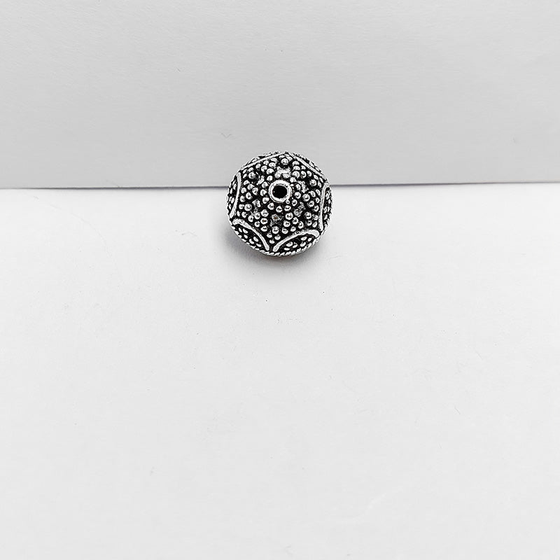Silver overlay over copper handcrafted ornamental circle bead from India with antique finish jewelry spacer
