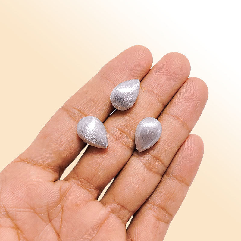 Elegant silver and copper teardrop shaped decor handcrafted in India with silver overlay finish