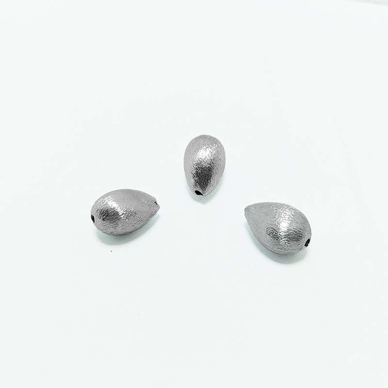 Elegant silver and copper teardrop shaped decor handcrafted in India with silver overlay finish