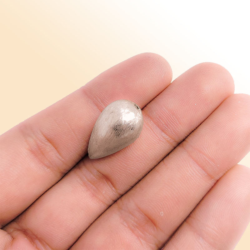 Elegant silver and copper teardrop shaped decor handcrafted in India with silver overlay finish