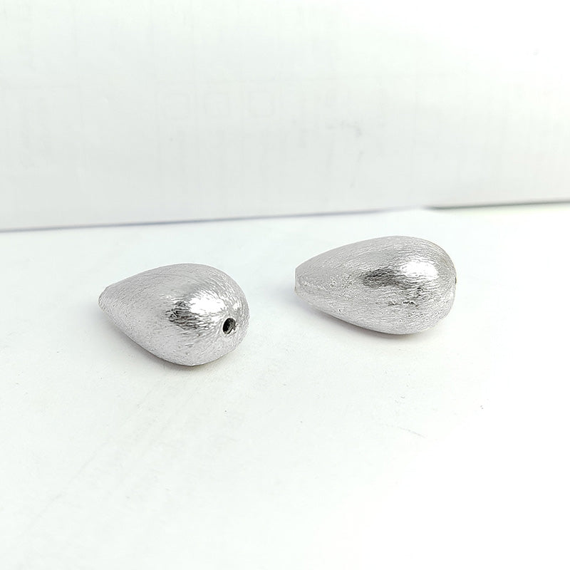 Elegant silver and copper teardrop shaped decor handcrafted in India with silver overlay finish
