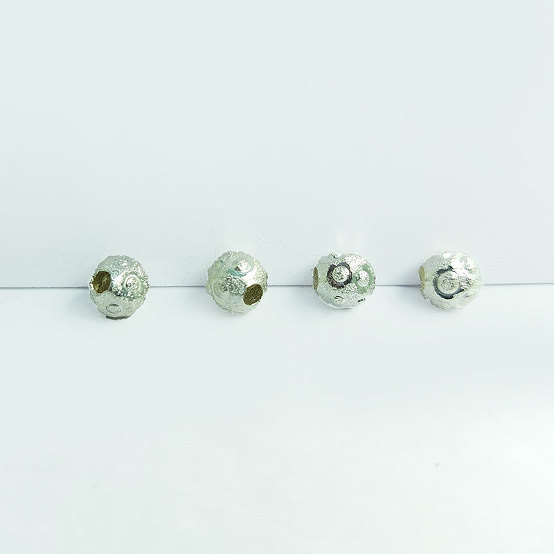 Artisan silver and copper textured sphere decor accent pair handcrafted in India with silver overlay finish