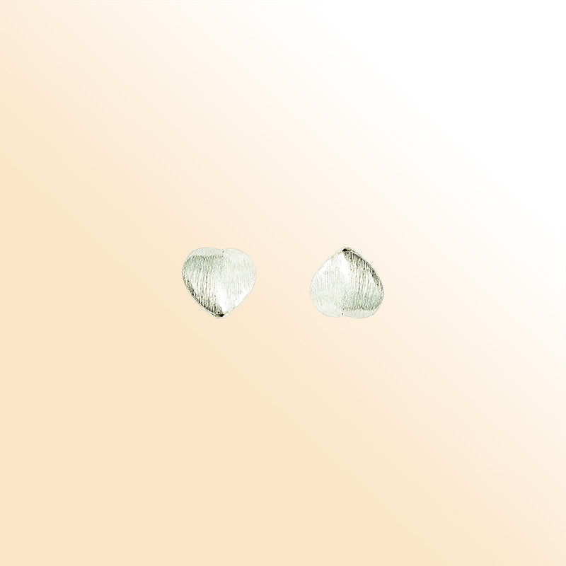 Elegant silver and copper heart shaped decor accent handcrafted in India with textured silver finish