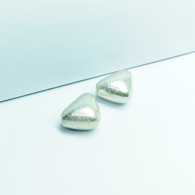 Modern silver and copper asymmetrical wedge decor accent handcrafted in India with textured silver finish