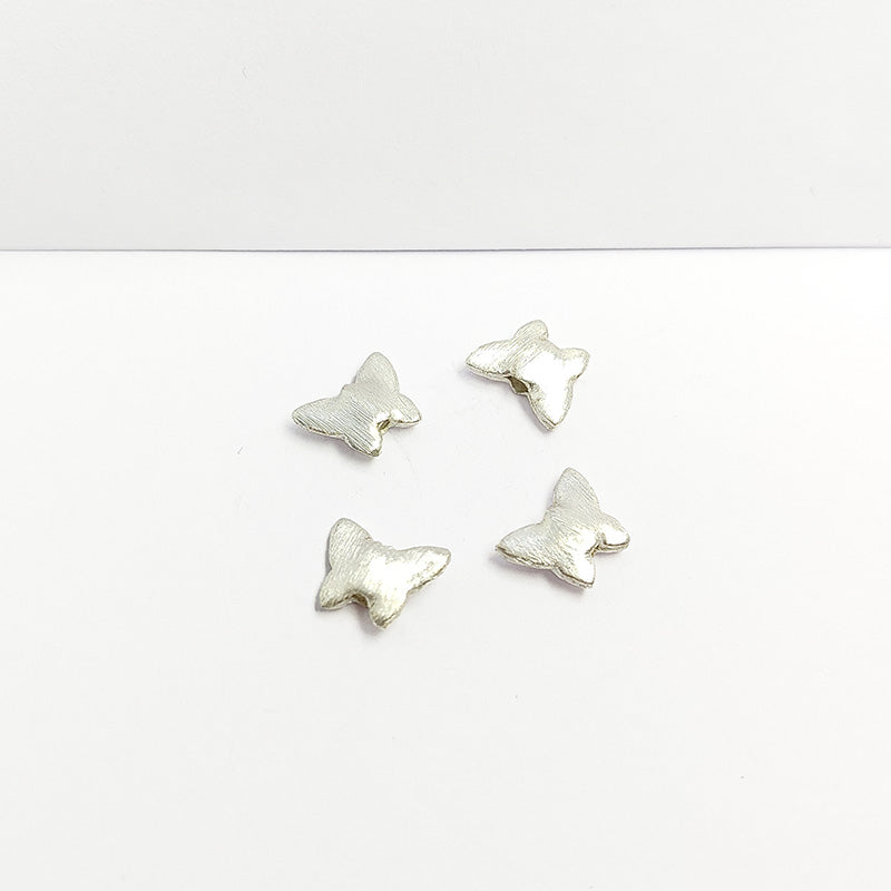 Charming silver and copper butterfly shaped decor bead handcrafted in India with textured silver finish