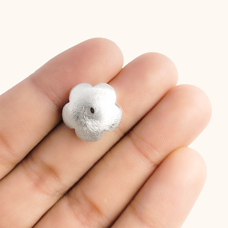 Elegant silver and copper flower shaped decor bead handcrafted in India with textured silver finish