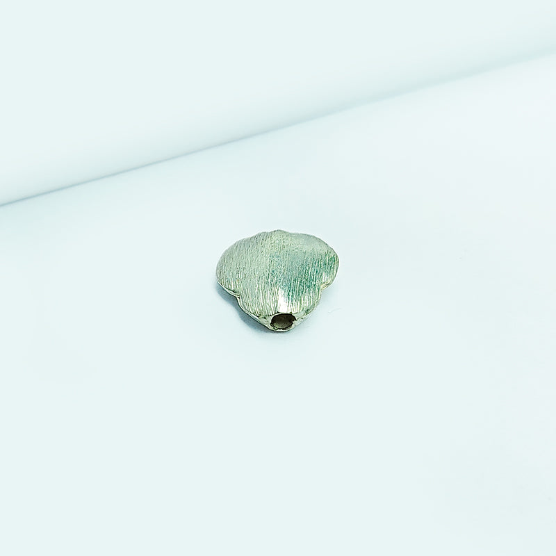 Minimal silver and copper flat oval decor accent handcrafted in India with textured silver finish
