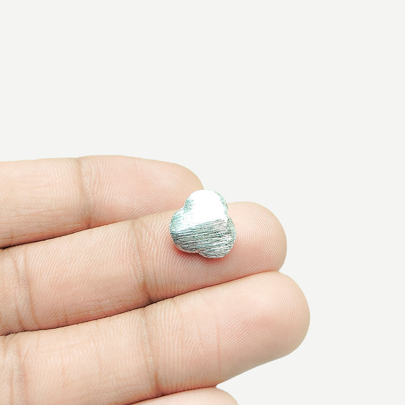 Minimal silver and copper flat oval decor accent handcrafted in India with textured silver finish