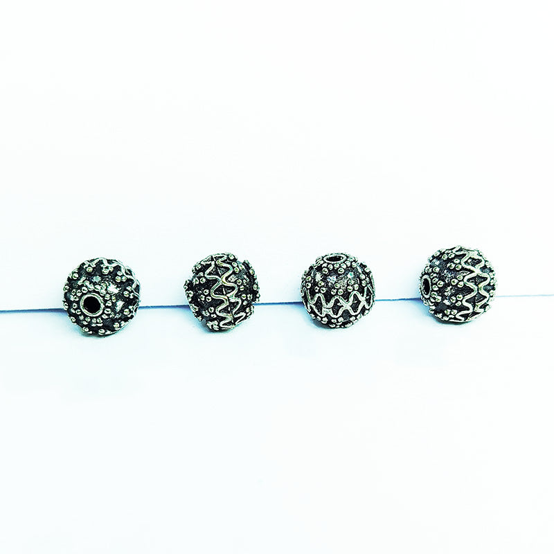 Silver overlay over copper antique dotted wave round bead handcrafted in India
