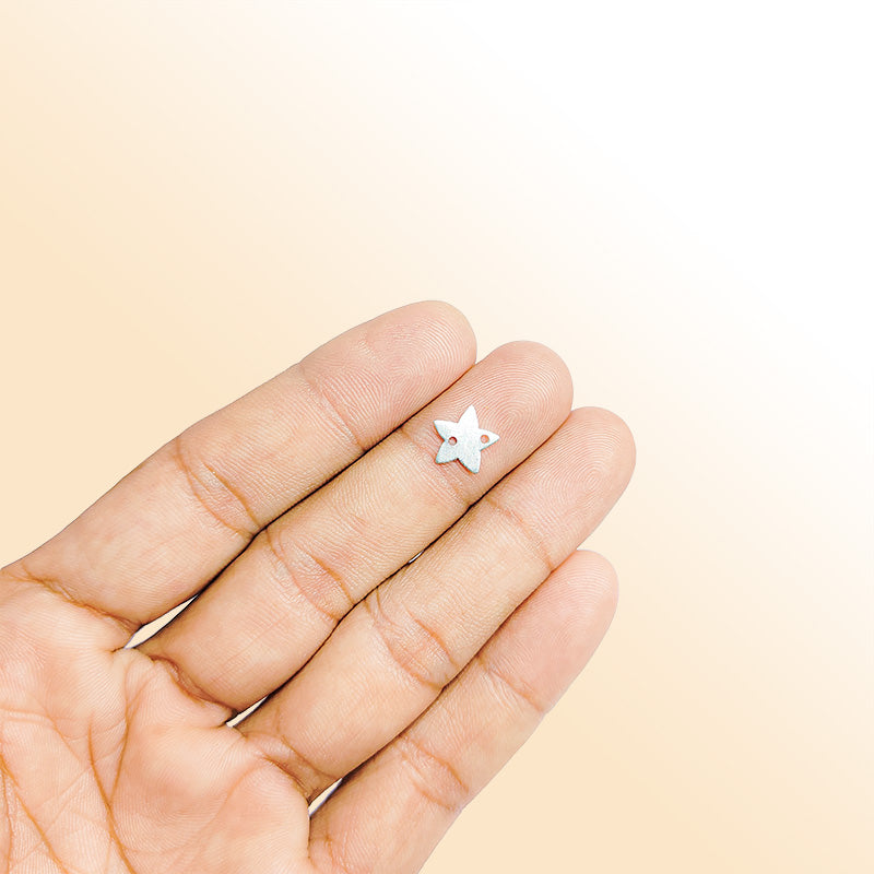 Handcrafted silver overlay star charm from India with brushed finish for modern jewelry designs