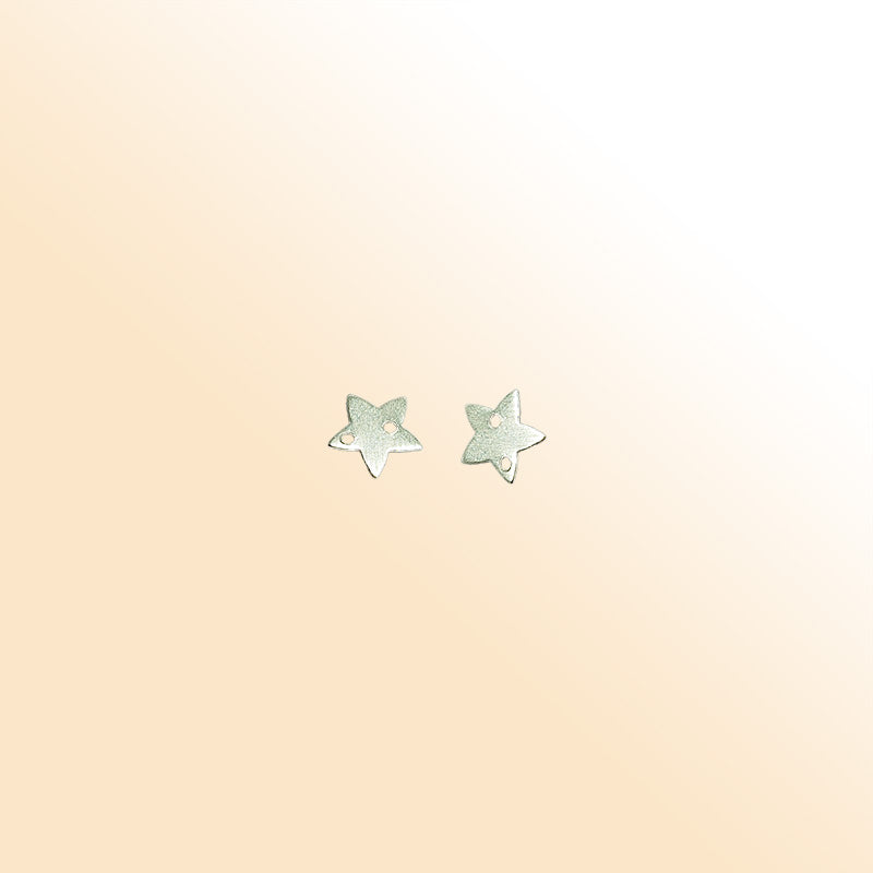 Handcrafted silver overlay star charm from India with brushed finish for modern jewelry designs