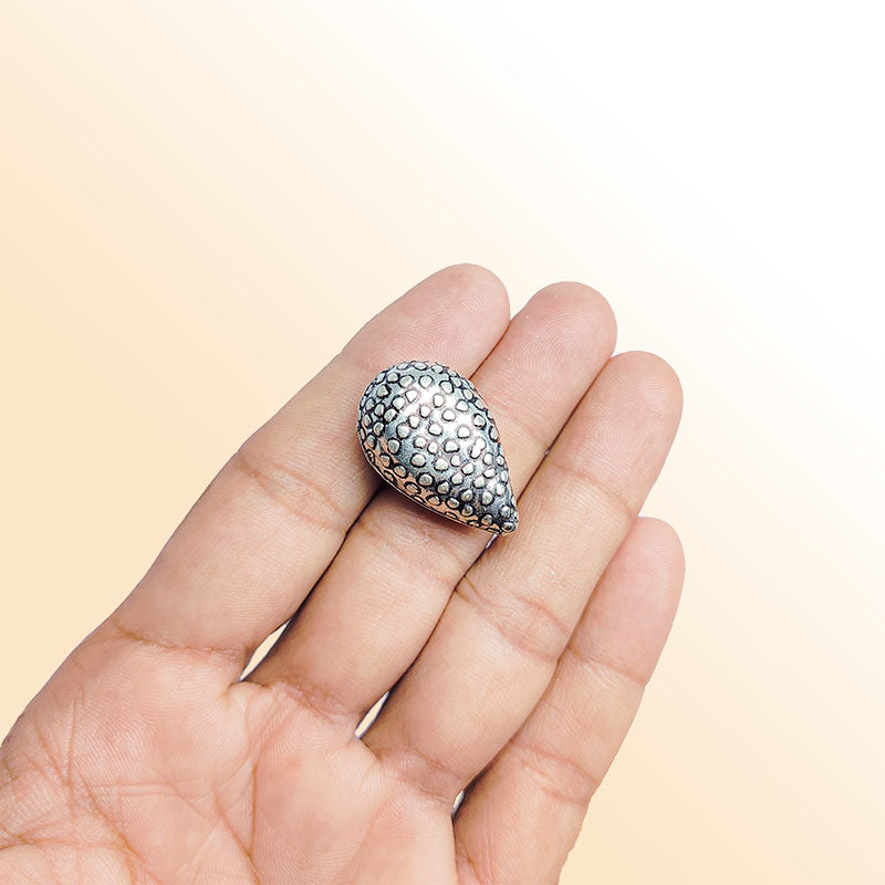 Silver India handcrafted teardrop charm with dotted texture and oxidized finish