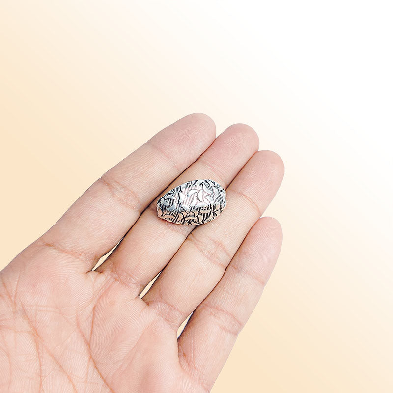 Silver textured teardrop charm handcrafted in India for handmade jewelry designs