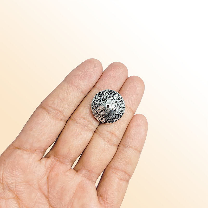 Silver bead cap from India with textured round design, handcrafted using silver overlay over copper for jewelry making.