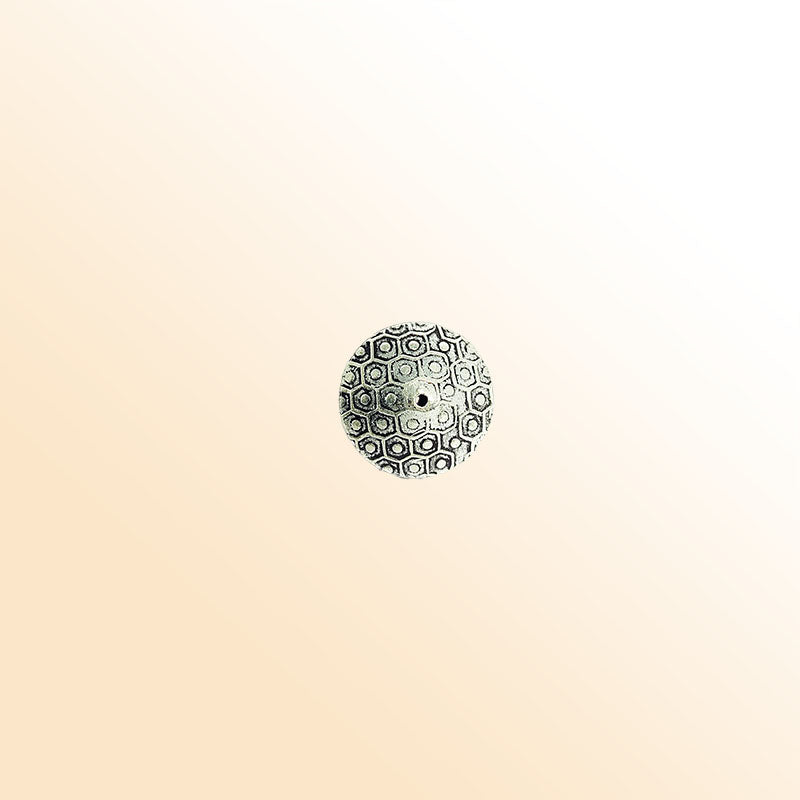 Silver bead cap from India with textured round design, handcrafted using silver overlay over copper for jewelry making.