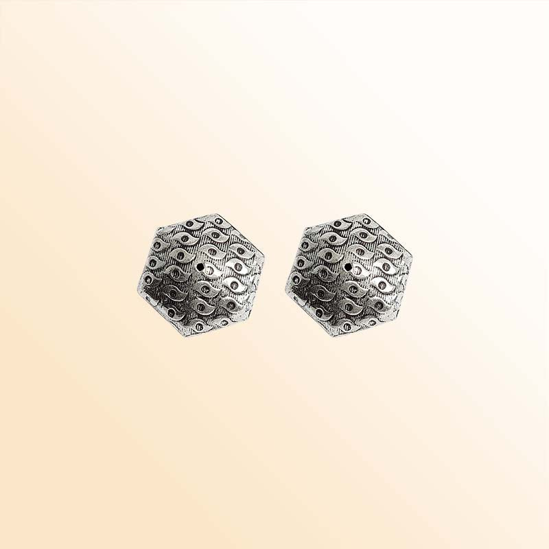 Silver hexagon bead cap from India with textured engraved design, handcrafted using silver overlay over copper.