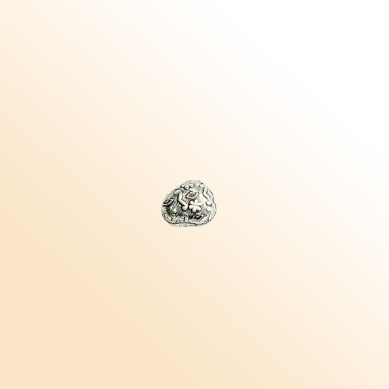 Silver tribal bead cap from India with textured artisan design, handcrafted using silver overlay over copper.