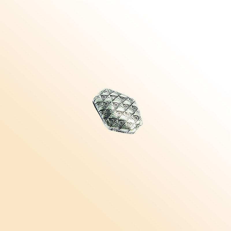 Silver faceted bead cap from India with geometric textured design, handcrafted using silver overlay over copper.
