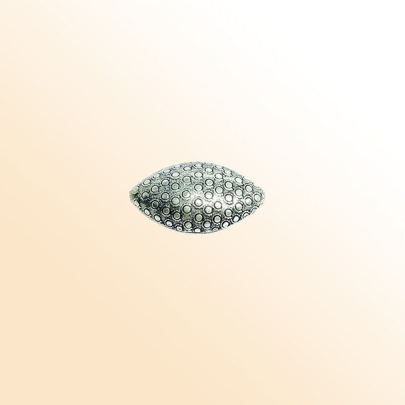 Silver oval bead cap from India with dotted textured design, handcrafted using silver overlay over copper.