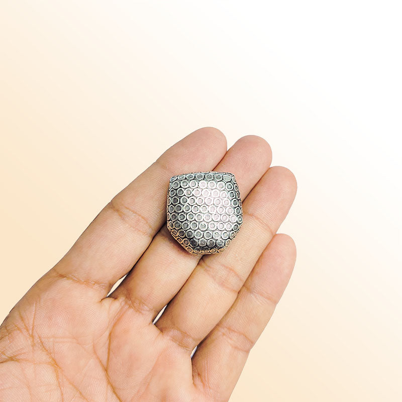 Silver faceted bead cap from India with dotted textured design, handcrafted using silver overlay over copper.