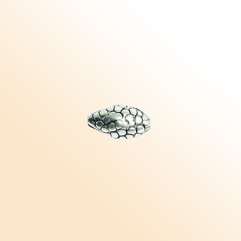 Silver oval bead cap from India with pebble textured design, handcrafted using silver overlay over copper.