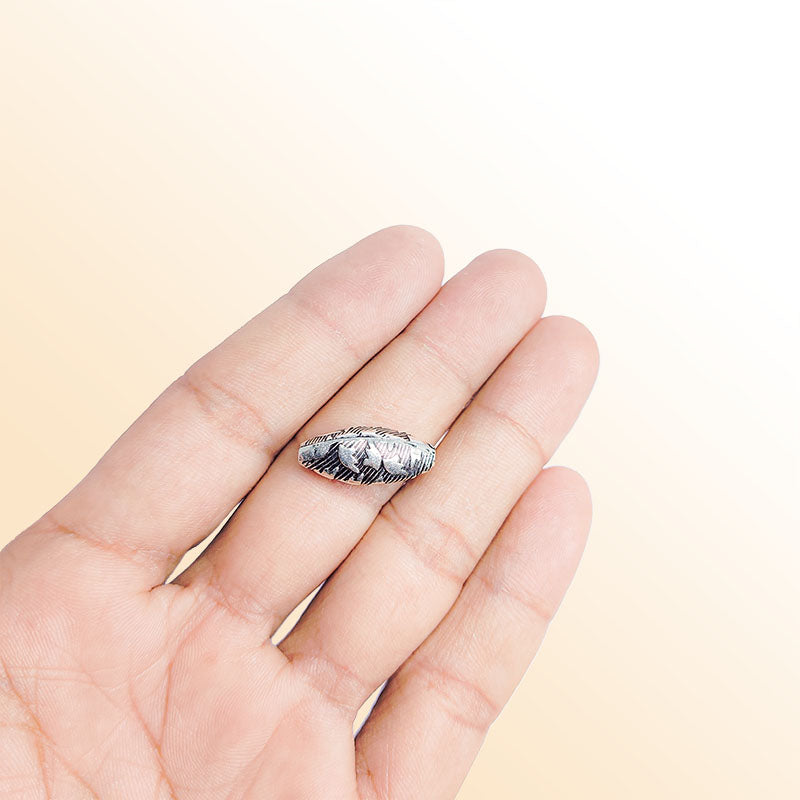 Silver marquise bead cap from India with leaf textured pattern, handcrafted using silver overlay over copper.