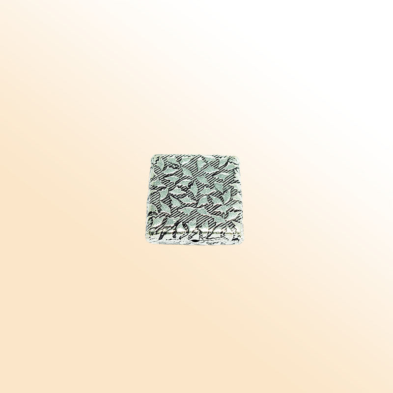 Handcrafted silver overlay over copper geometric bead from India with antique silver finish