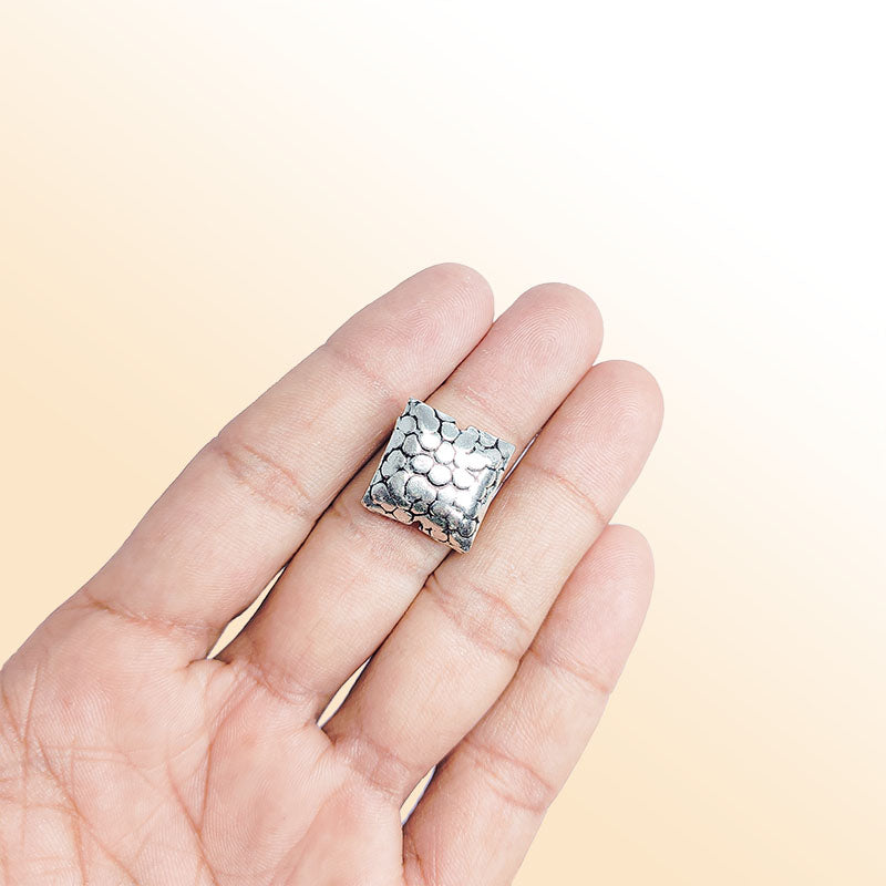 Handcrafted stone texture silver overlay over copper square bead from India with antique silver finish