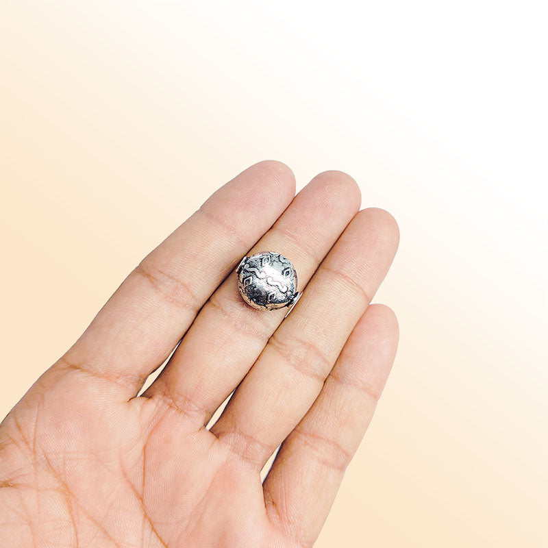 Decorative round silver overlay over copper bead handcrafted in India with engraved ethnic patterns