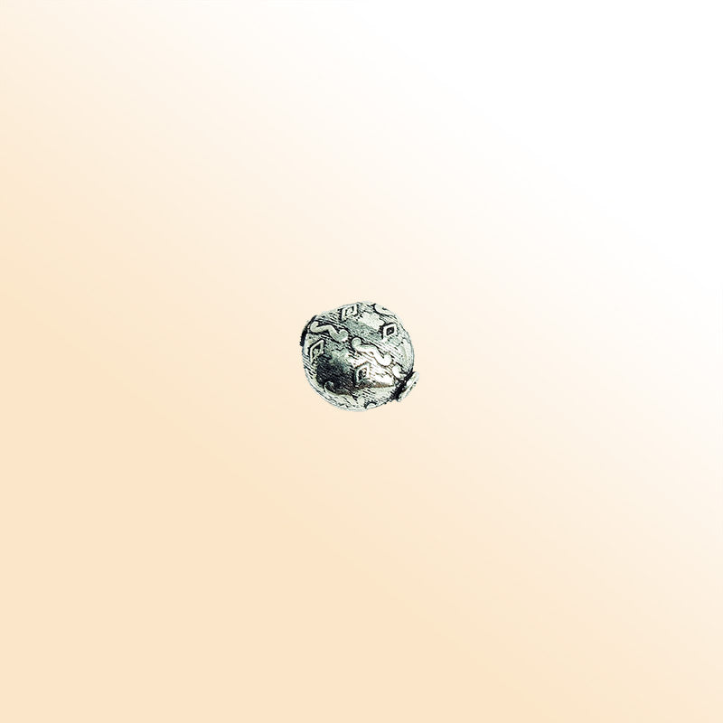 Decorative round silver overlay over copper bead handcrafted in India with engraved ethnic patterns