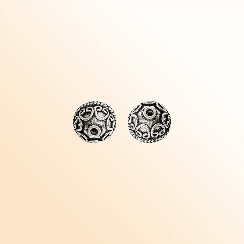Ornate silver overlay over copper round bead handcrafted in India with scrollwork and rope design