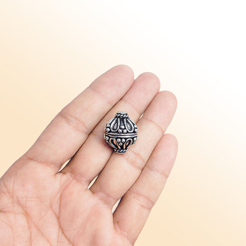 Petal pattern silver overlay over copper round bead handcrafted in India with dotted detailing