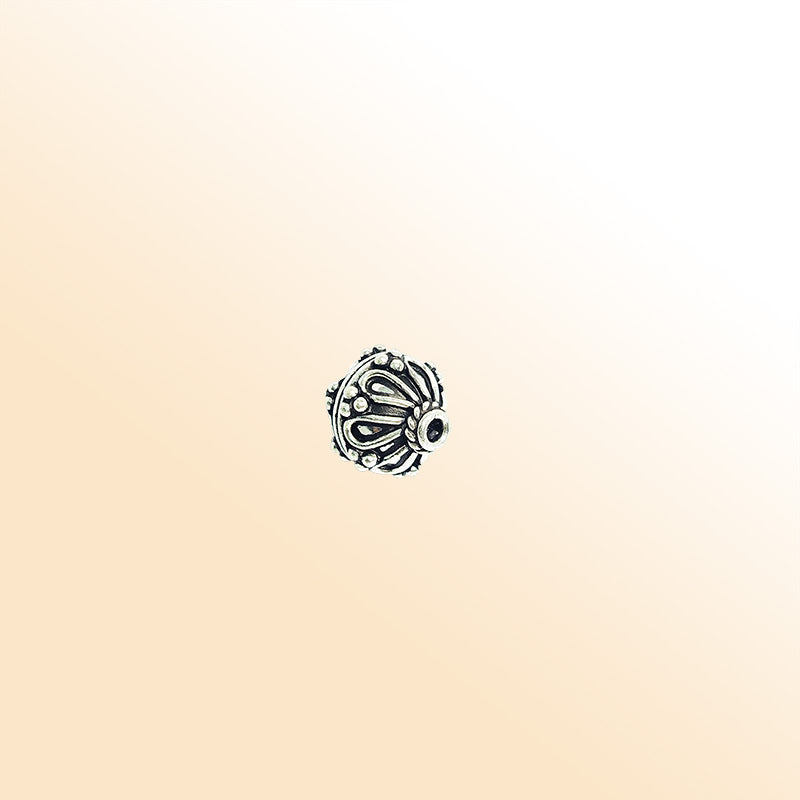 Petal pattern silver overlay over copper round bead handcrafted in India with dotted detailing