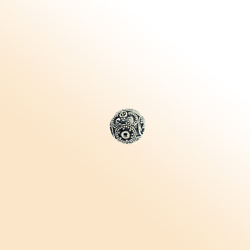 Granulated silver overlay over copper round bead handcrafted in India with dotted detailing