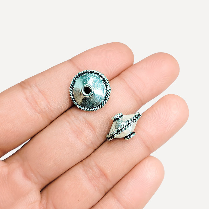 Artisan silver overlay over copper bicone bead with twisted rope detail, handcrafted in India for boutique jewelry makers.