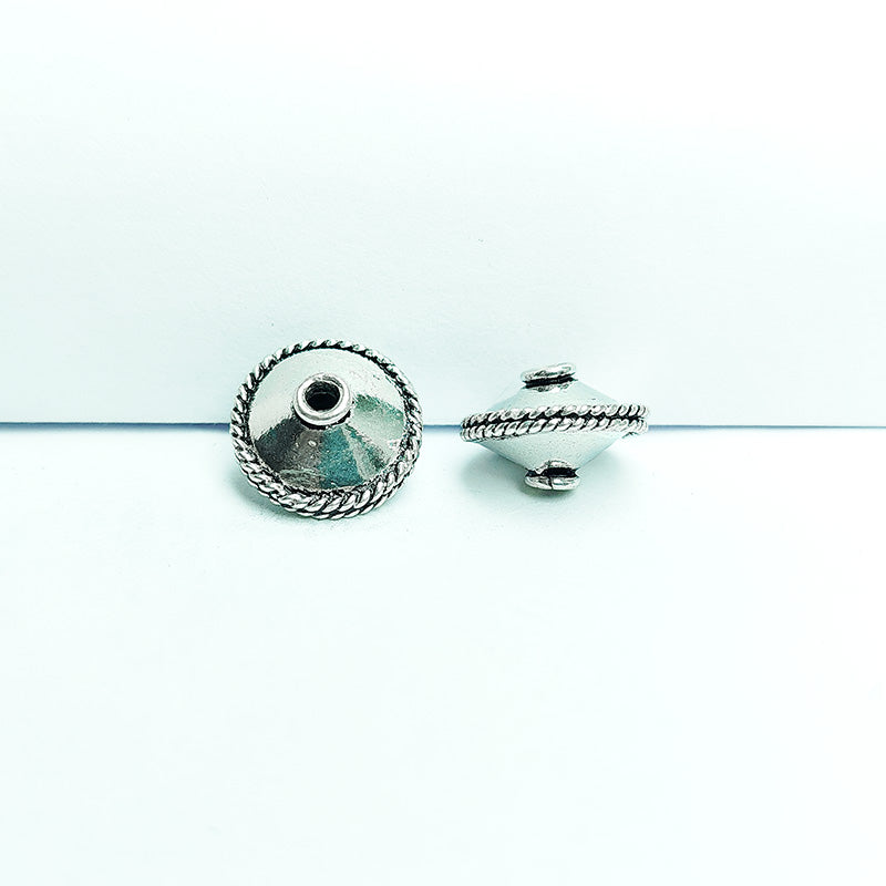 Artisan silver overlay over copper bicone bead with twisted rope detail, handcrafted in India for boutique jewelry makers.
