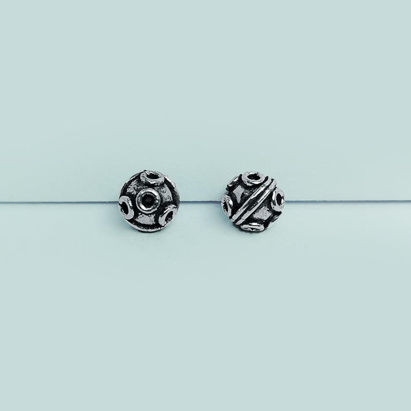 Handcrafted Silver Overlay Over Copper round beads from India with raised circular motifs and antique silver finish for DIY jewelry.