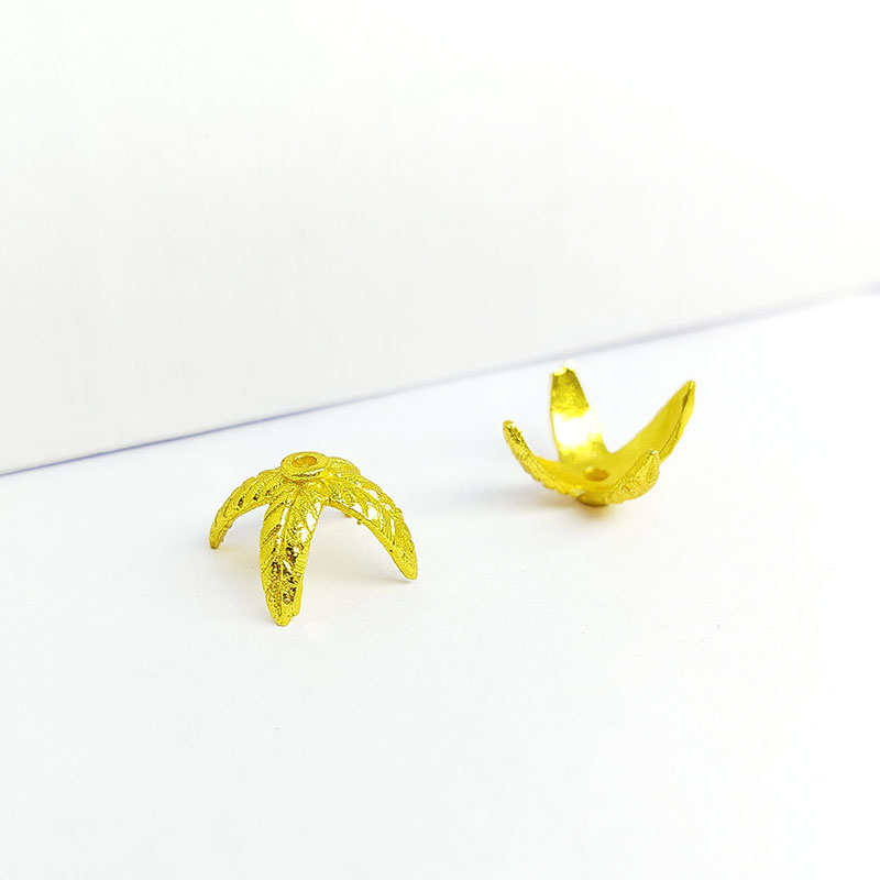 Handcrafted four-petal floral spacer made with 18K Gold Overlay Over Copper from India for jewelry making