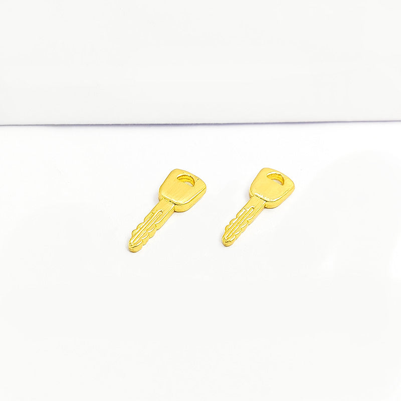 Handcrafted key shape pendant in 18K Gold Overlay Over Copper from India for symbolic and artistic jewelry designs.
