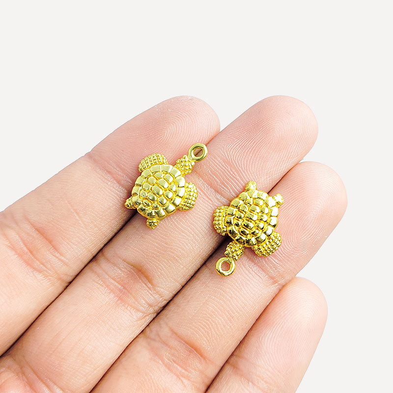 Handcrafted turtle shape pendant in 18K Gold Overlay Over Copper from India for symbolic and artistic jewelry designs.