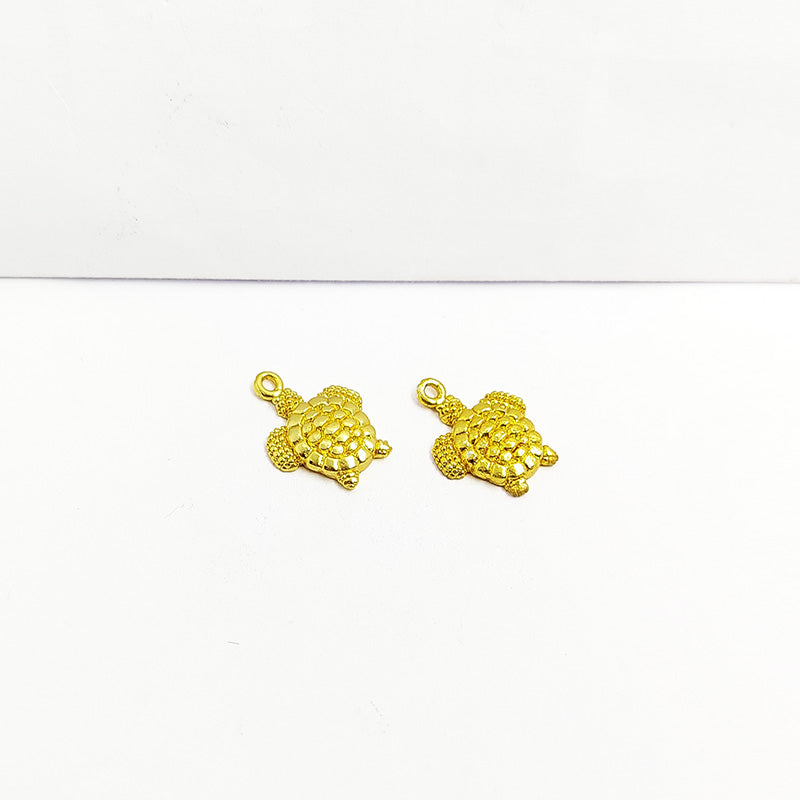 Handcrafted turtle shape pendant in 18K Gold Overlay Over Copper from India for symbolic and artistic jewelry designs.
