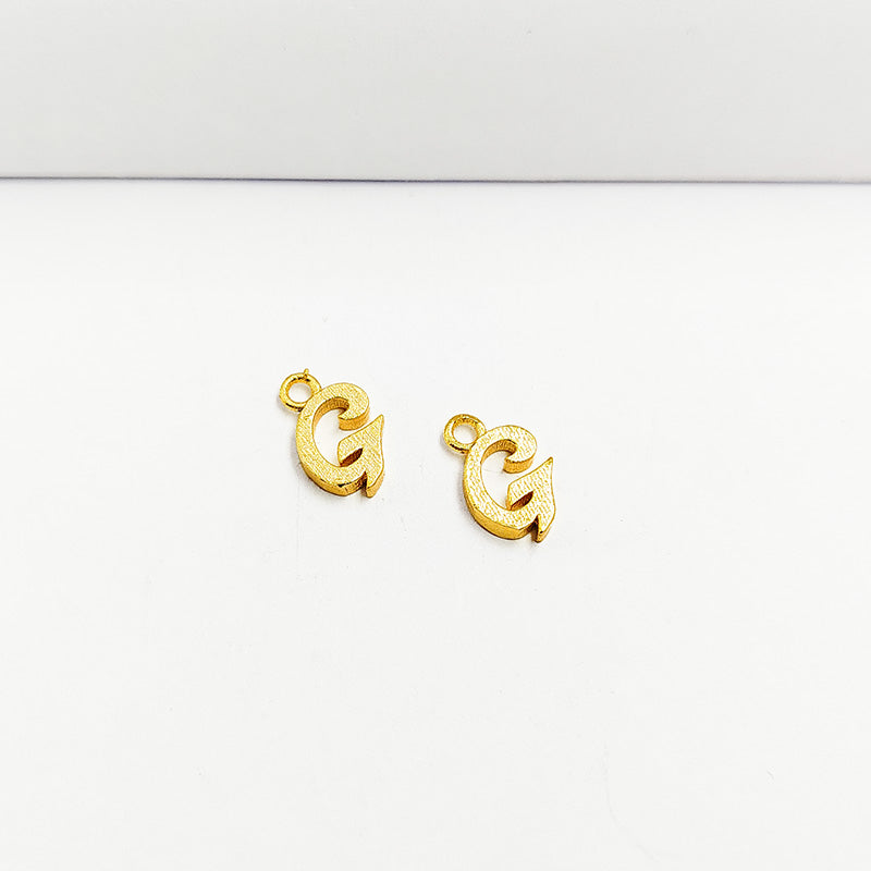 Handcrafted letter G Charm made with 18K Gold Overlay Over Copper, textured script initial charm from India