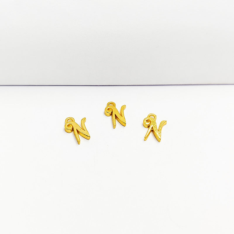 ‘N’ charm handcrafted in India with elegant textured gold-tone finish for everyday jewelry use.