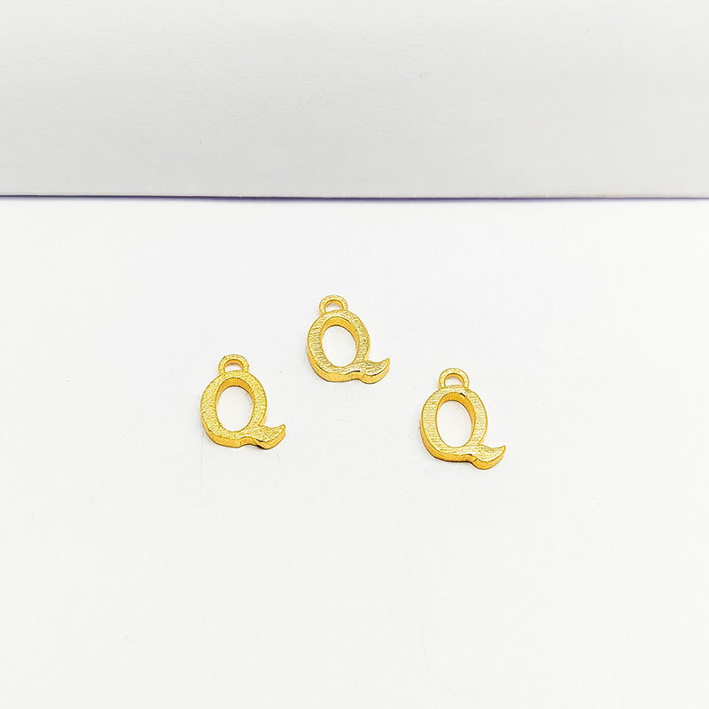 ‘Q’ charm handcrafted in India featuring 18K Gold Overlay Over Copper with elegant textured finish.