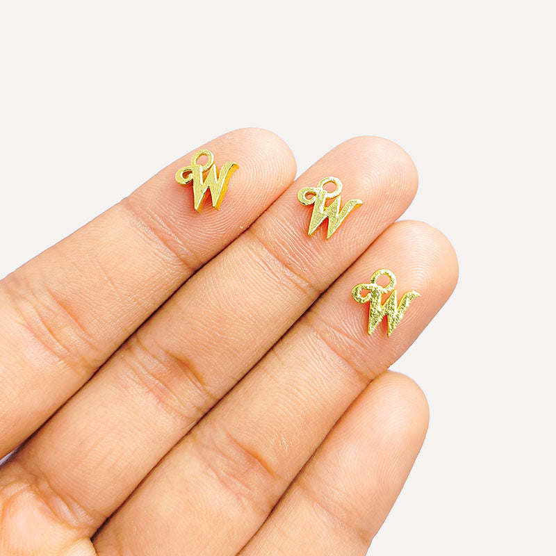 ‘W’ charm handcrafted in India featuring 18K Gold Overlay Over Copper with elegant textured finish.