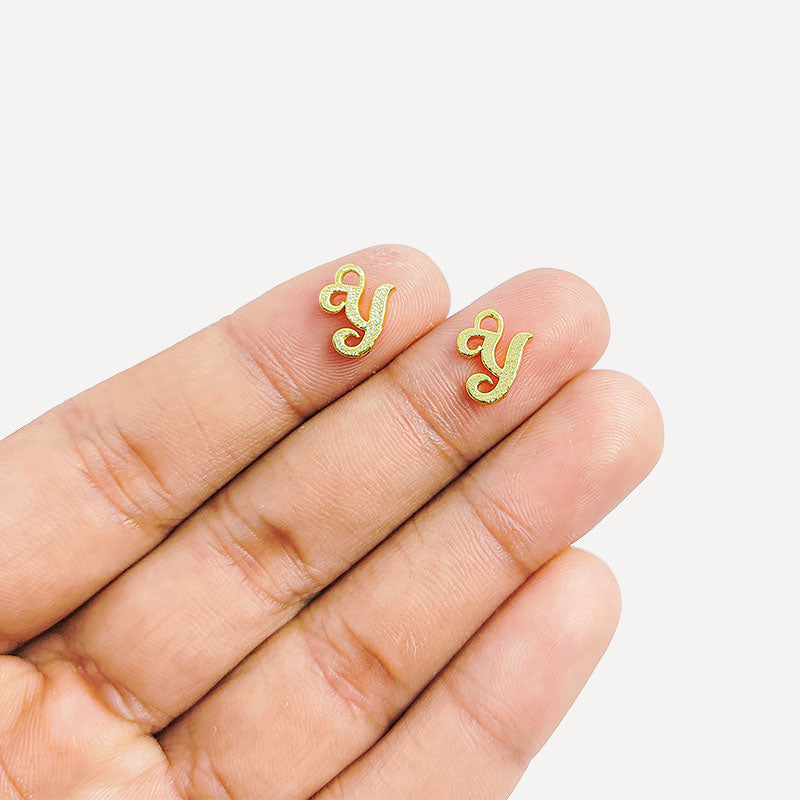 ‘Y’ charm handcrafted in India featuring 18K Gold Overlay Over Copper with elegant textured finish.