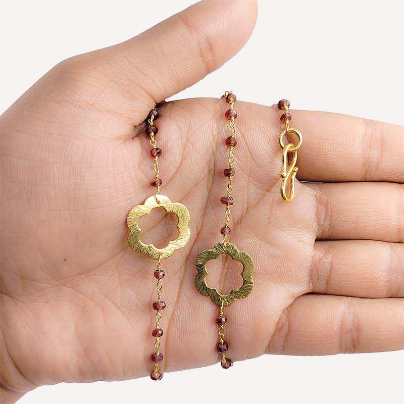 Elegant red garnet beaded necklace with floral motif accents and smooth 18K Gold Overlay Over Copper designed for everyday and festive wear