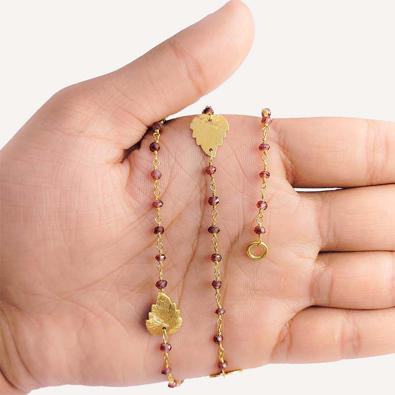 Elegant red garnet beaded necklace with leaf motif accents and smooth 18K Gold Overlay Over Copper designed for everyday and festive wear