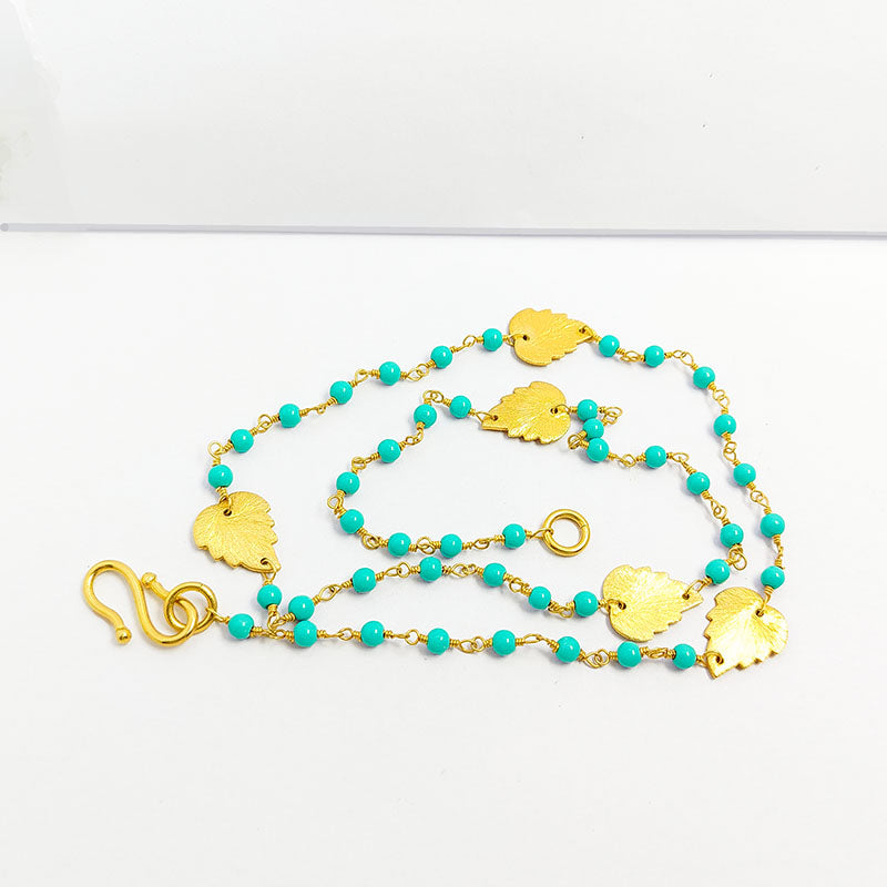 Elegant turquoise shell beaded necklace with leaf motif accents and smooth 18K Gold Overlay Over Copper designed for everyday and festive wear