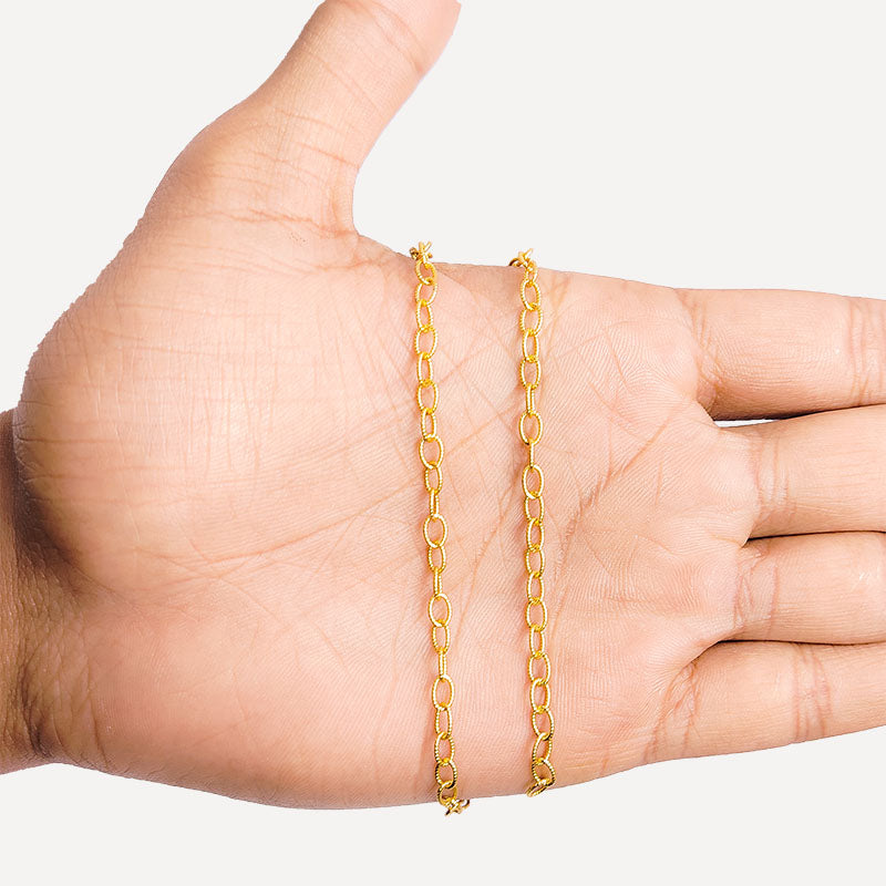 Textured oval link chain made with 18K Gold Overlay Over Copper featuring twisted detailing, smooth polished finish, and flexible length sold per foot for custom jewelry projects